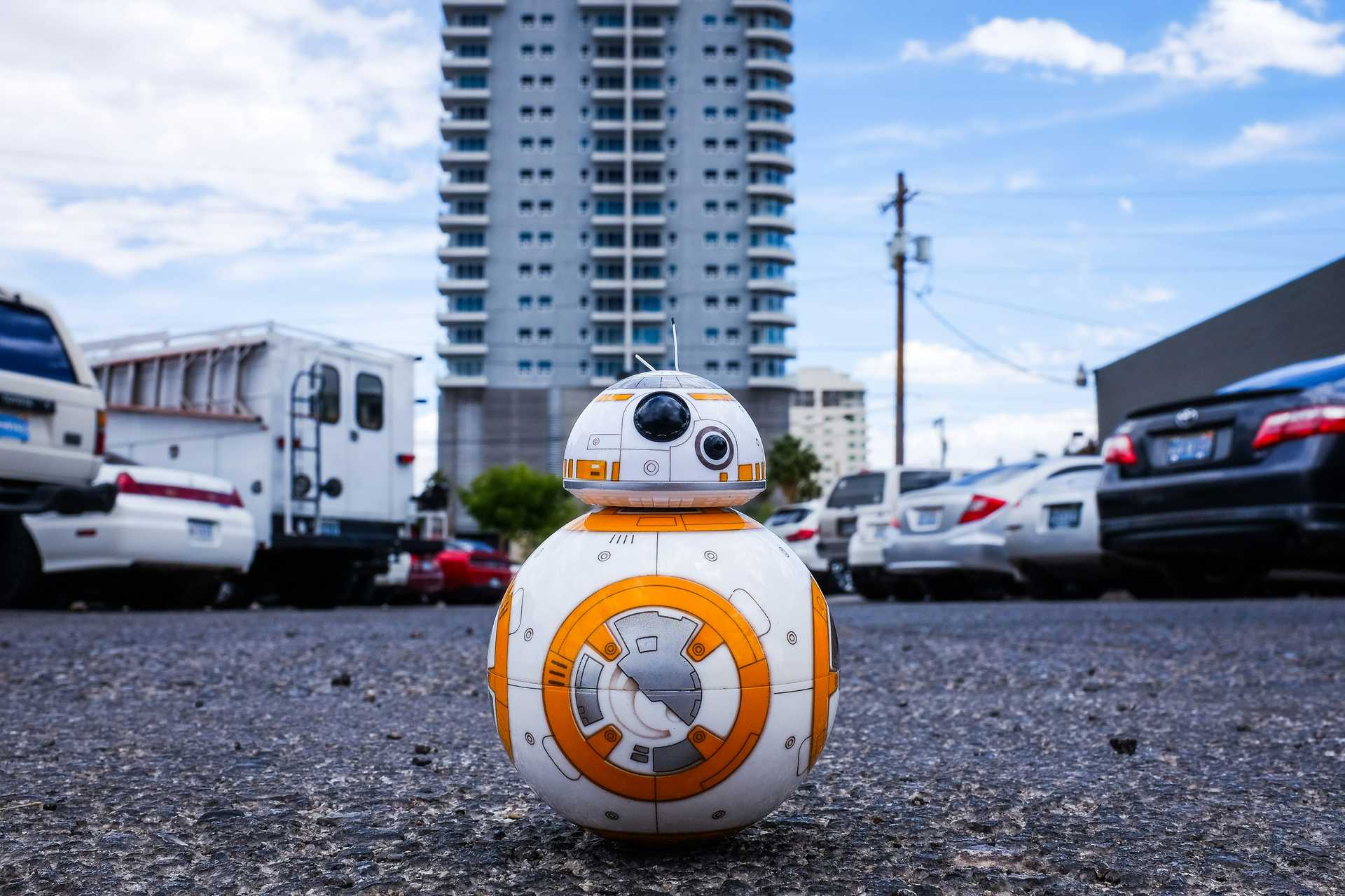 A Star Wars BB-8 robot standing on the road