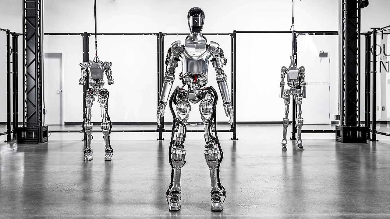 Three humanoid robots are standing